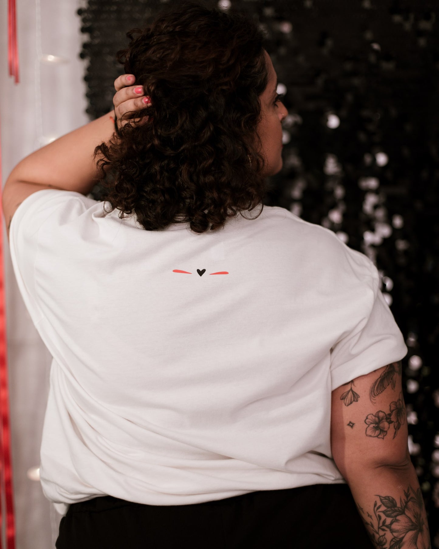 Graphic tee with a powerful feminist design, showcasing a gorgeous black and red design. Stylish and statement-making.